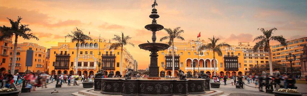 Plaza with fountain flanked by buildings