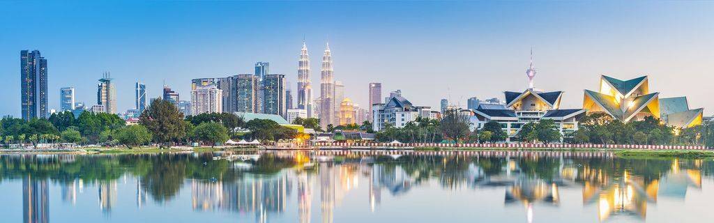 Kuala Lumpur skyline daylight reflecting on water