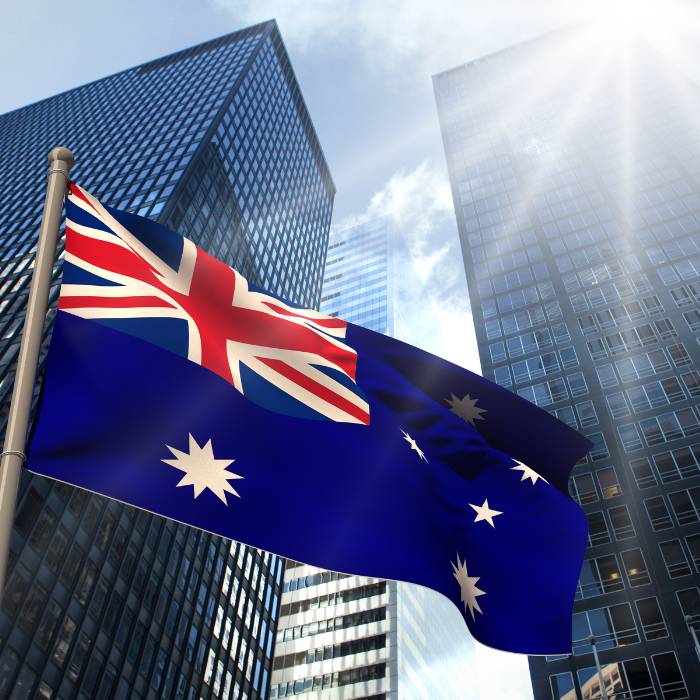 Australia Flag over City Background