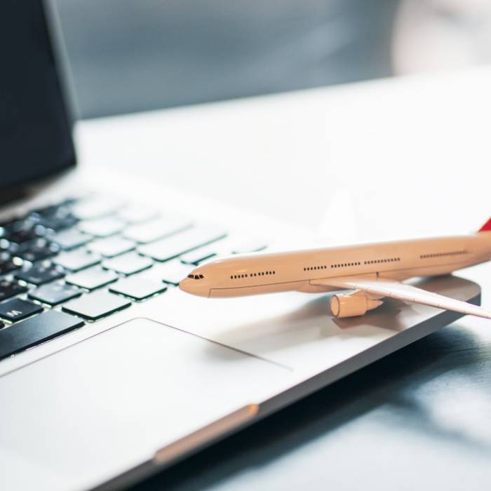 Laptop with model airplane