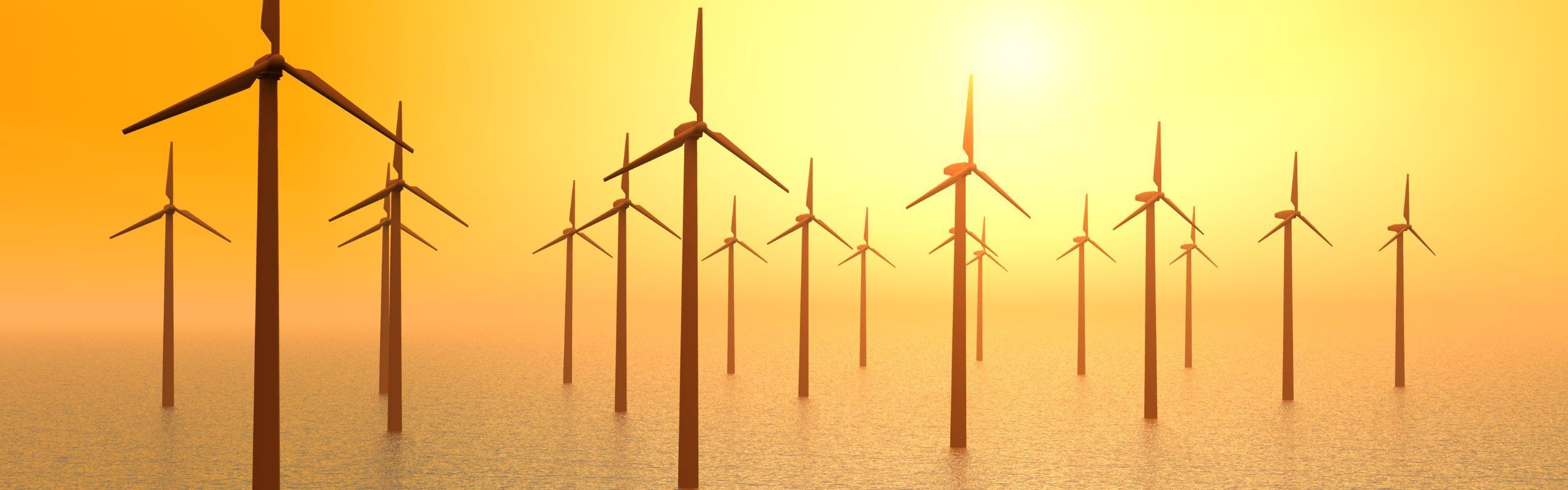 Image of wind turbines in the ocean against an orange sunset