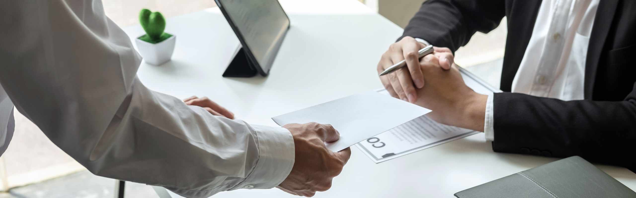 General business or office image, meeting of two people handling paper