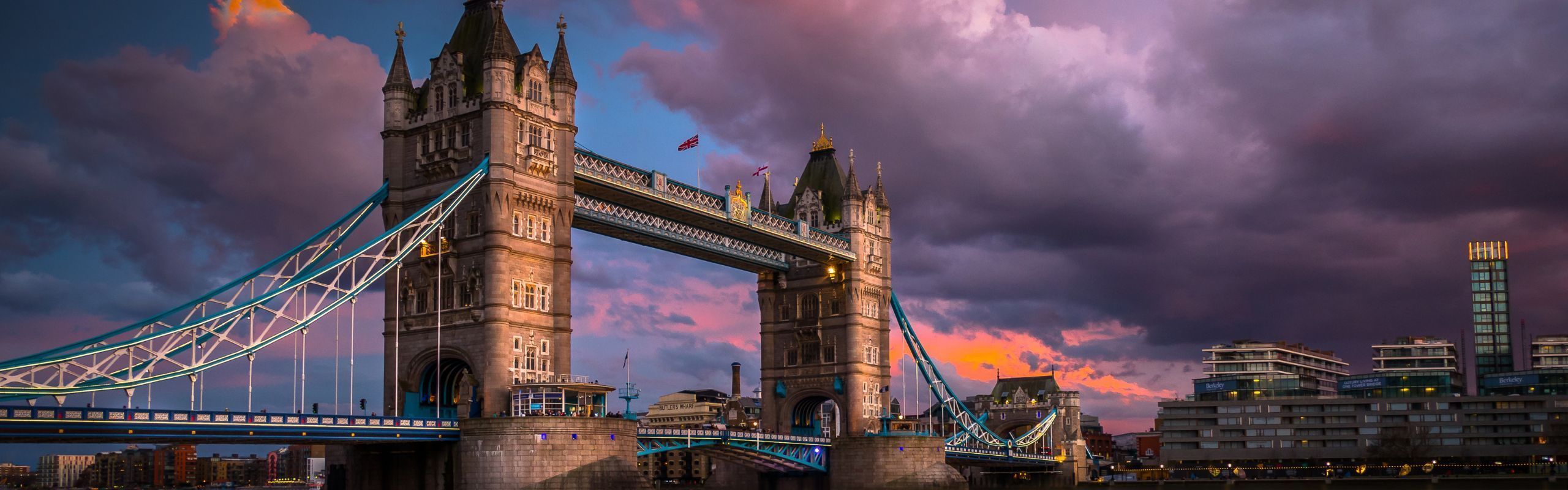 Image of the Tower Bridge in London against a purple sky