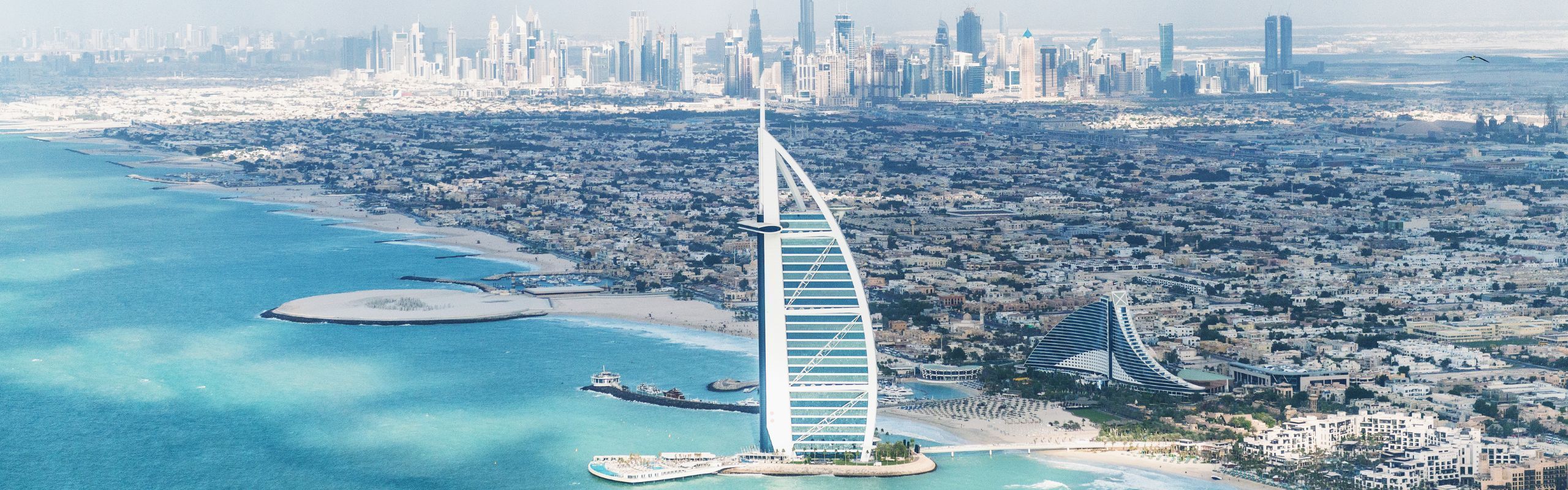 Image of an aerial view of Dubai next to the water